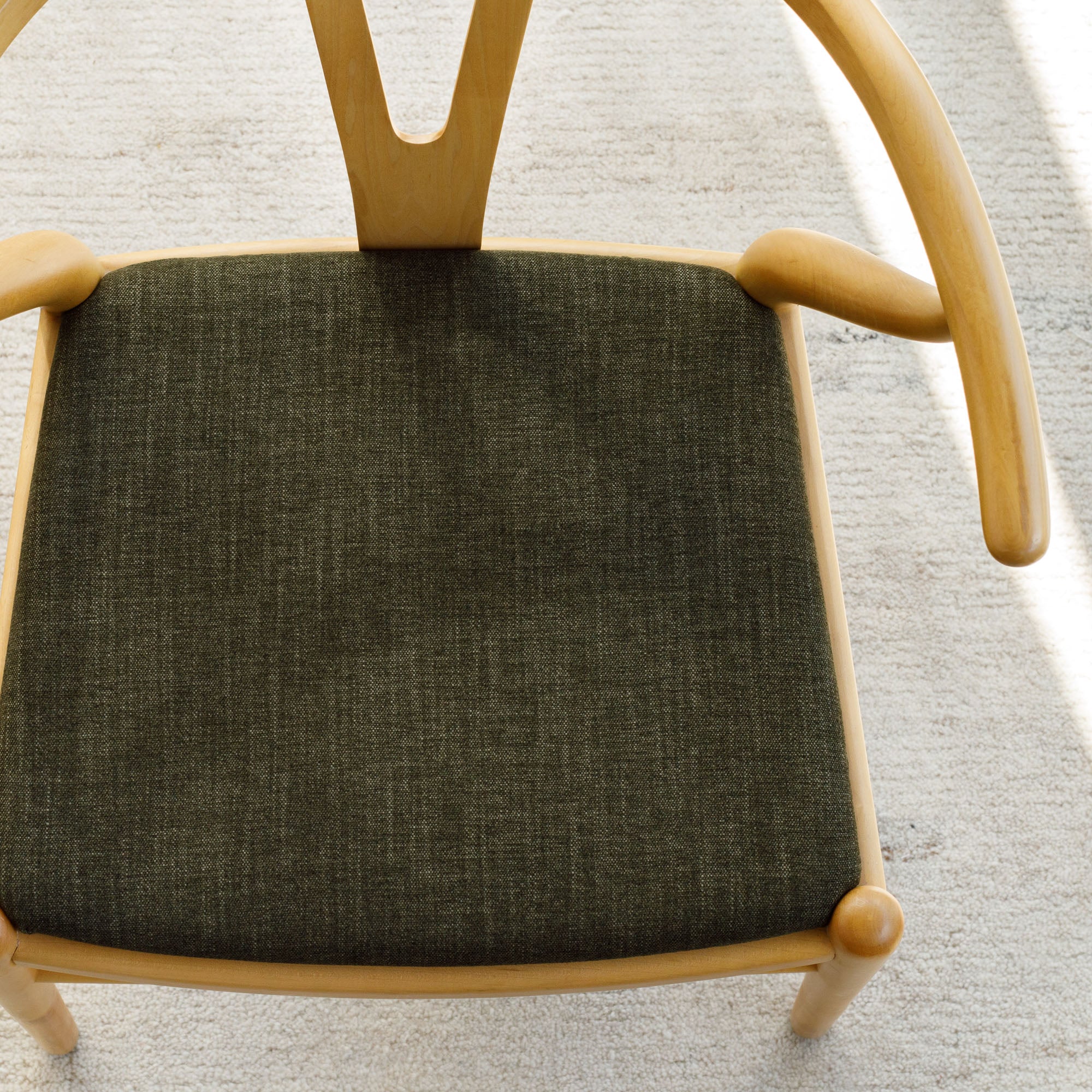 Dining chair in Tonic Living Bedford Moss olive-green chenille upholstery fabric.