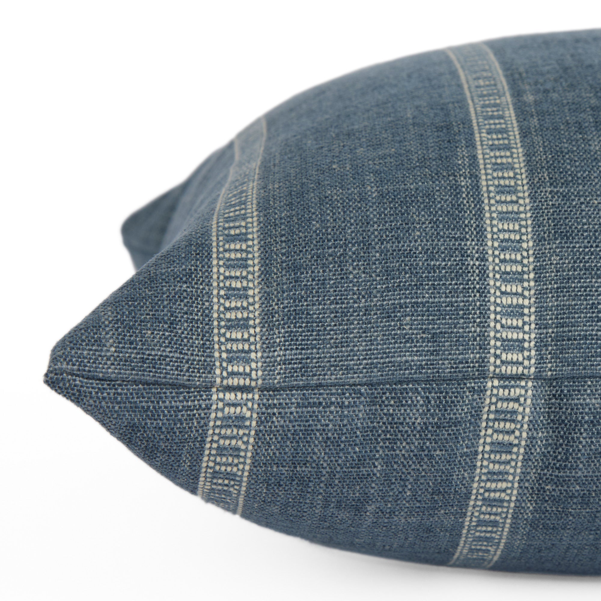 Side view of Brunswick Stripe 14x20 Lumbar Pillow, Chambray by Tonic Living — decorative cushion with fine chenille stripes in chambray blue and white.