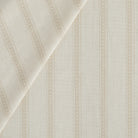 Tonic Living Brunswick Stripe home decor fabric in Parchment shown in a soft, neutral cream stripe.