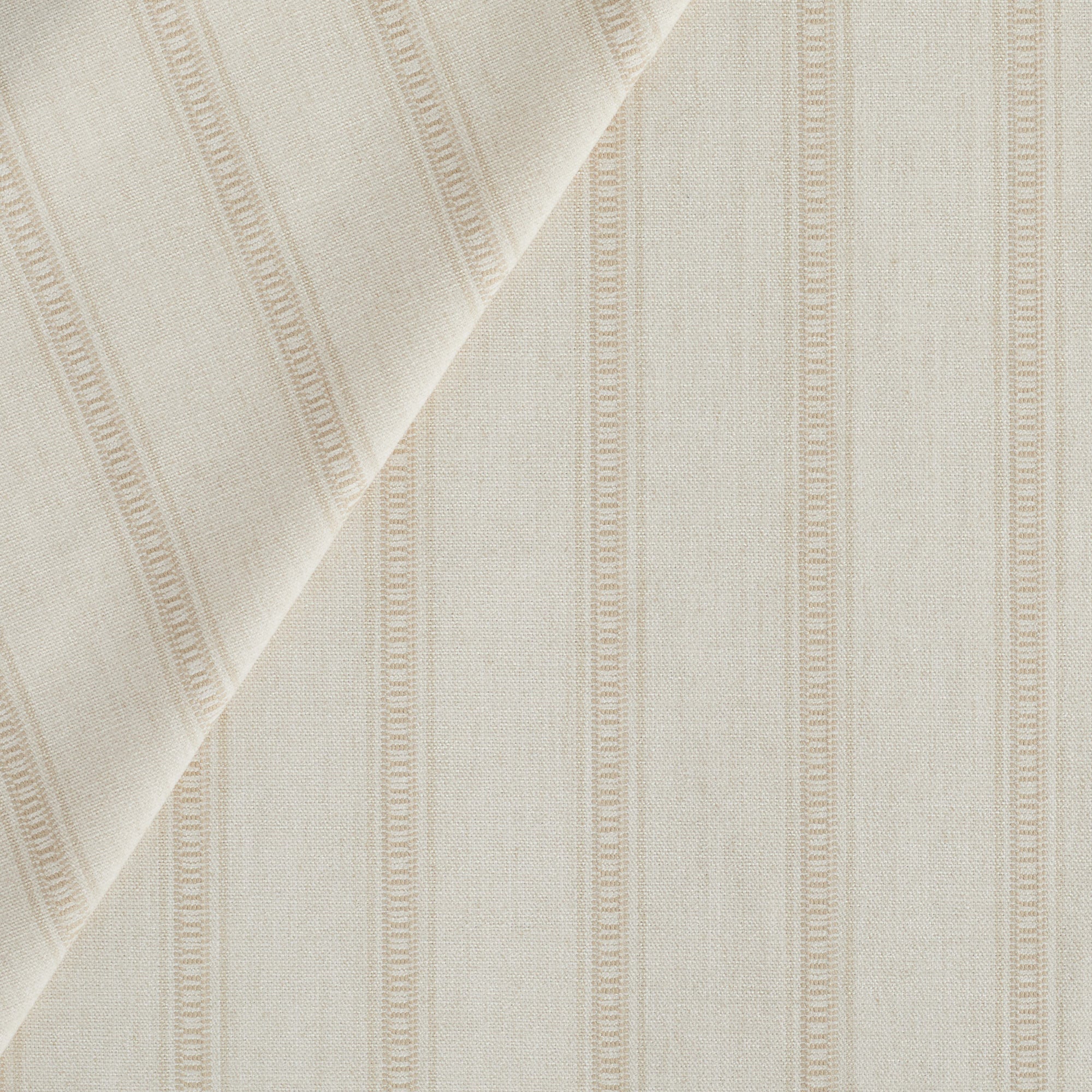 Tonic Living Brunswick Stripe home decor fabric in Parchment shown in a soft, neutral cream stripe.