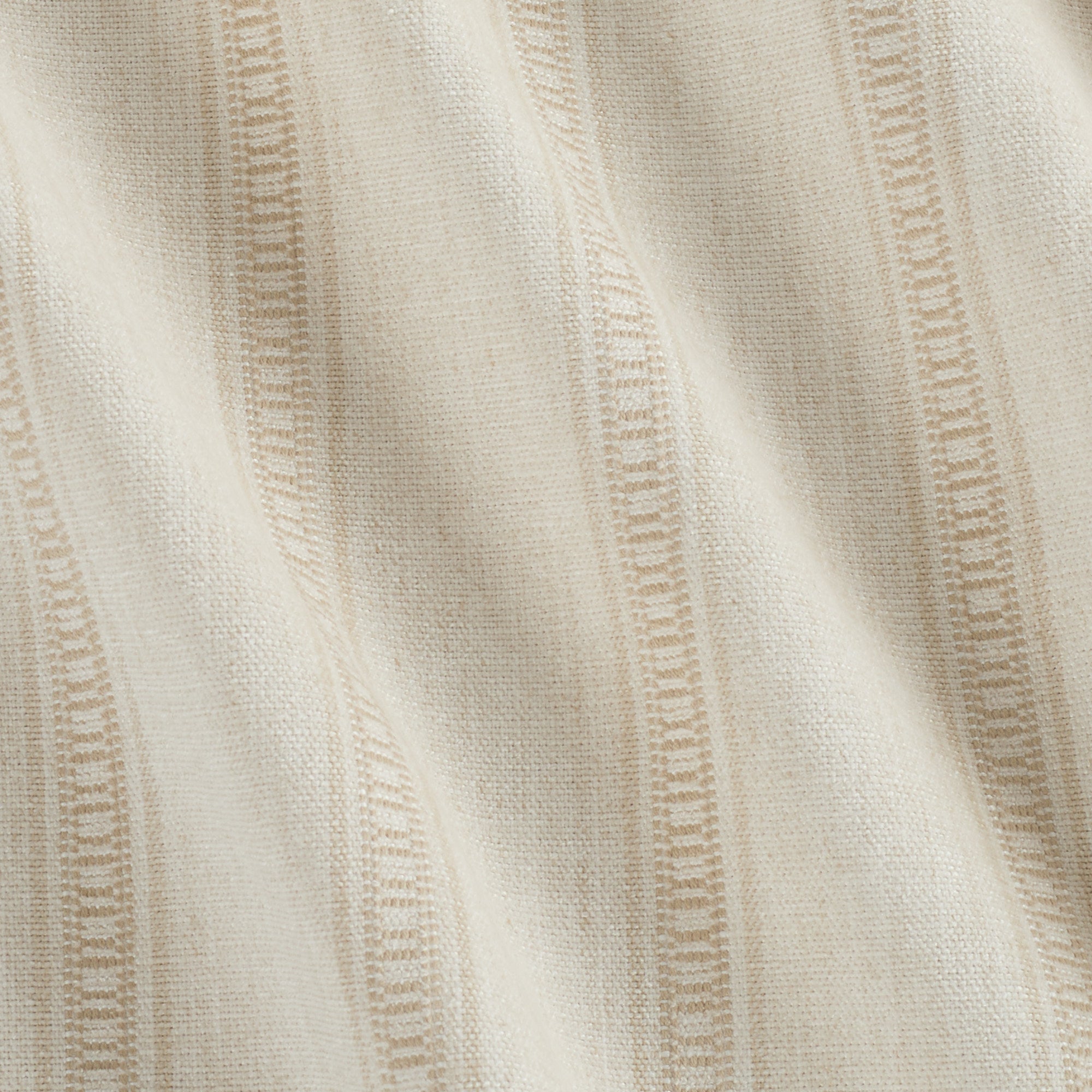 Close up of Tonic Living Brunswick Stripe home decor fabric in Parchment showing its subtle stripe texture.