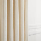 Tonic Living Brunswick Stripe fabric in Parchment sewn as drapery for a soft, neutral window look.