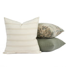 Tonic Living Brunswick cream pillow centred in front of two green-toned cushions for a layered look.