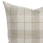 A sage green, oatmeal and caramel plaid throw pillow: a close up view.