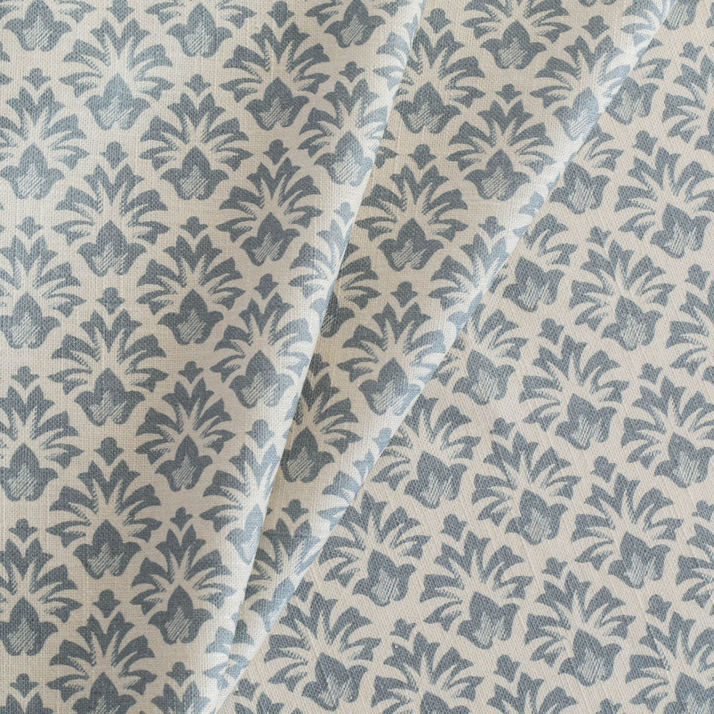 Calli Fabric Indigo, a earthy blue and sandy cream floral block print drapery fabric from Tonic Living