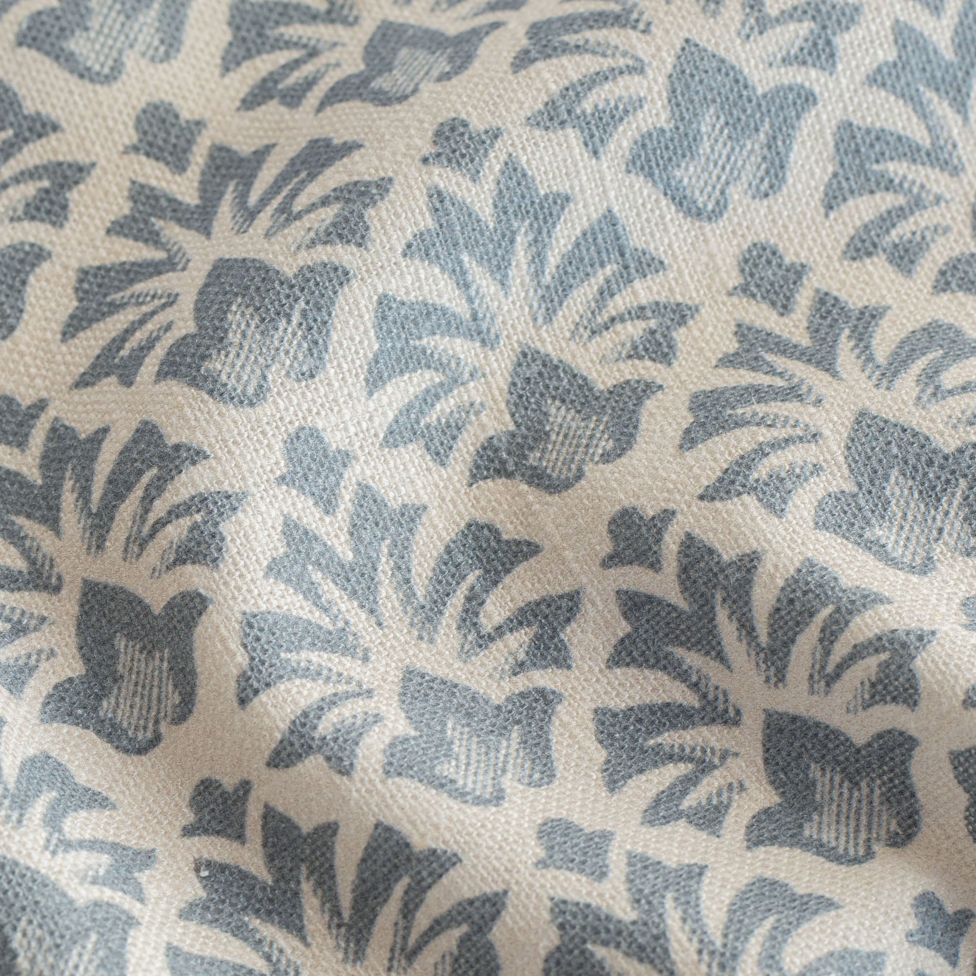 a blue and cream floral block print fabric
