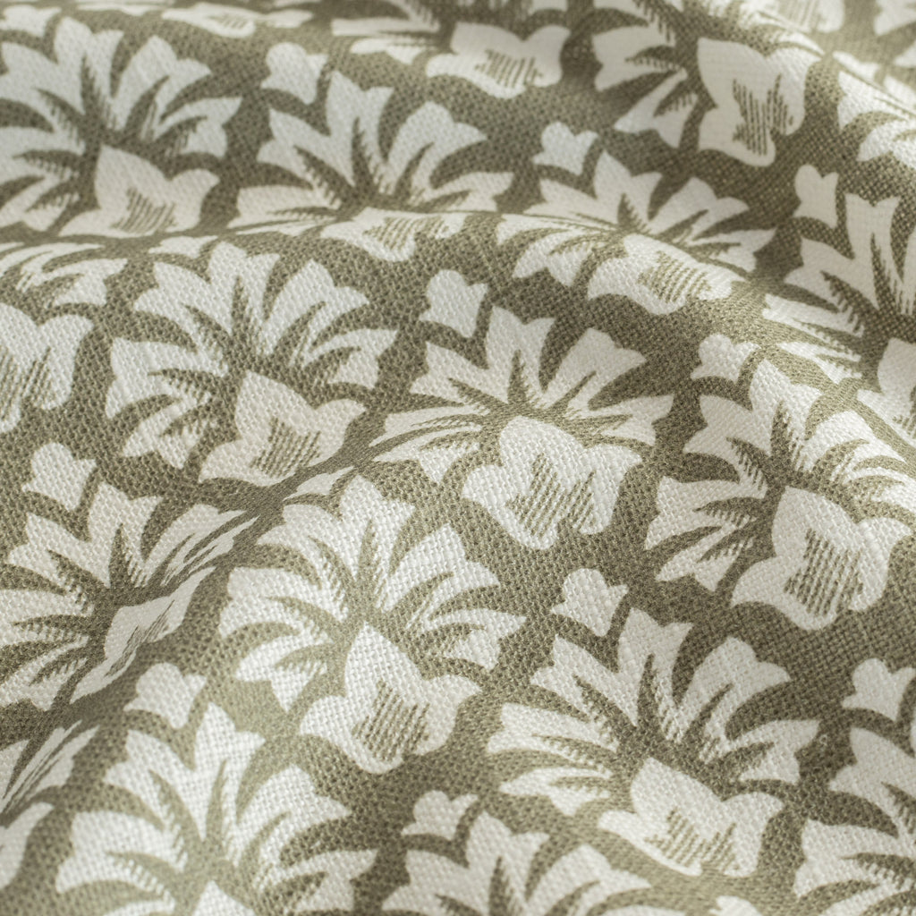 a moss green and cream floral block print linen blend fabric