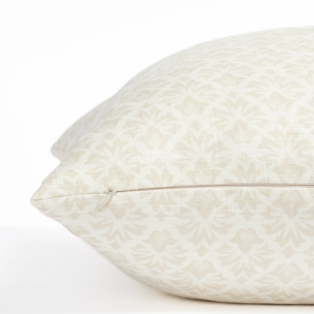 a cream and putty beige floral block print throw pillow : close up zipper view