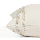 Close up of Tonic Living Caper outdoor cushion showing off-white and light brown dotted stripe detail.