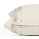 Side zipper detail of Tonic Living Caper 22x22 outdoor toss pillow in a neutral off-white and tan stripe.