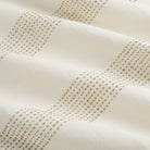 Tonic Living Caper Sunbrella Linen performance fabric featuring embroidered stripe in light brown and white tones.