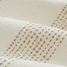 Close up of Tonic Living Caper Sunbrella Linen fabric showing raised stitched stripe detail in creamy white and light brown.