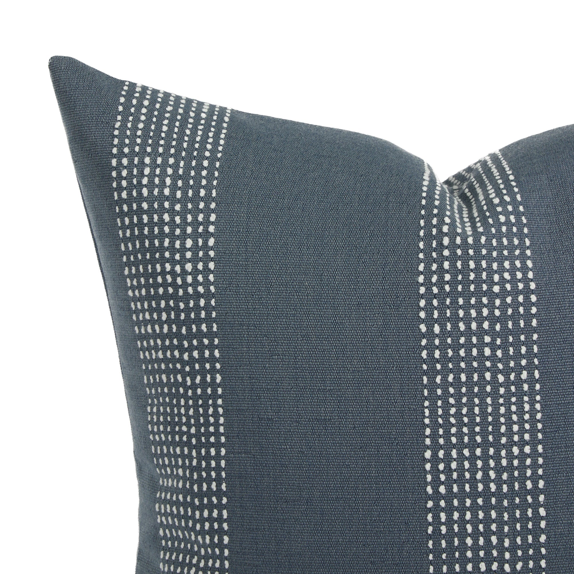 Close up of Tonic Living Caper outdoor cushion showing blue and white dotted stripe detail.