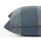 Side zipper detail of Tonic Living Caper 22x22 outdoor toss pillow in blue and white stripe.