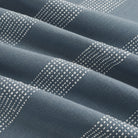 Tonic Living Caper Sunbrella Slate indoor/outdoor upholstery fabric with soft banded stripe in slate blue and white.