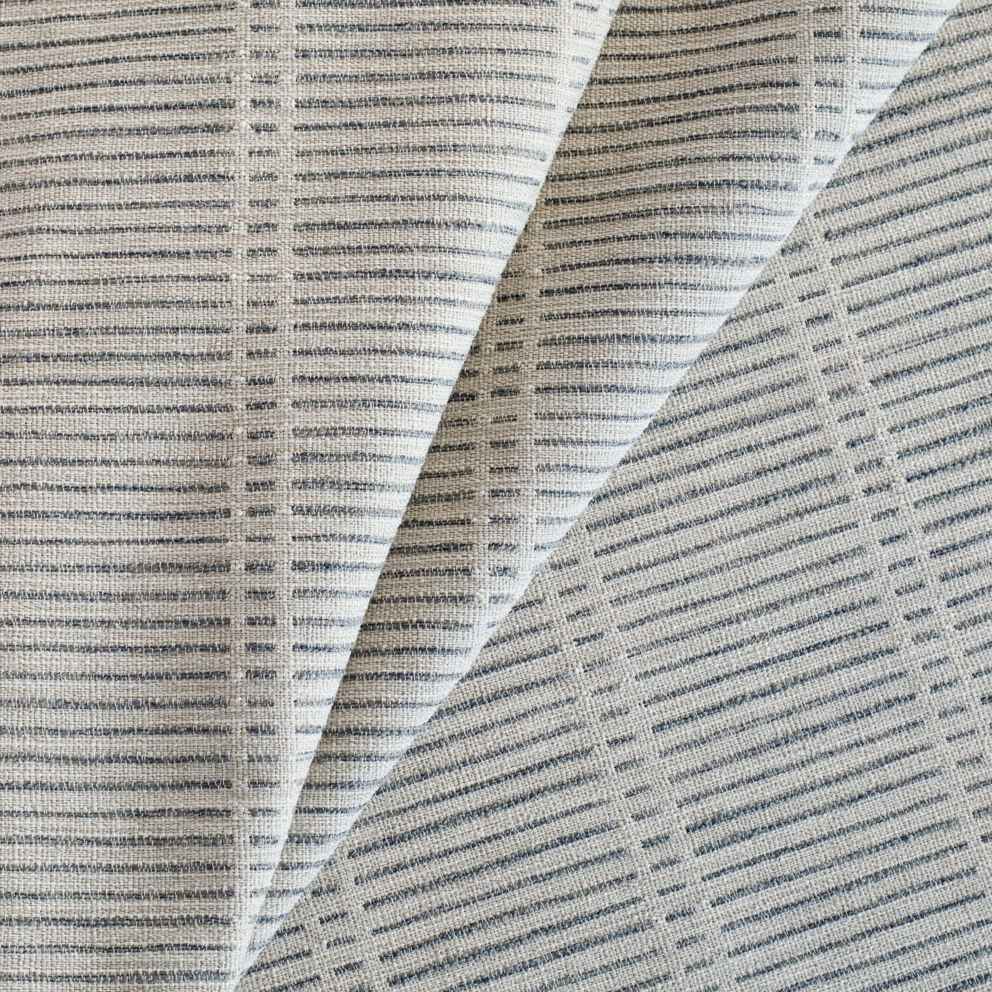 Carson Stripe Stone Blue Fabric, a woven greige and blue dashed stripe patterned upholstery fabric from Tonic Living