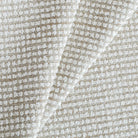 a greige and white nubby textured high performance upholstery fabric