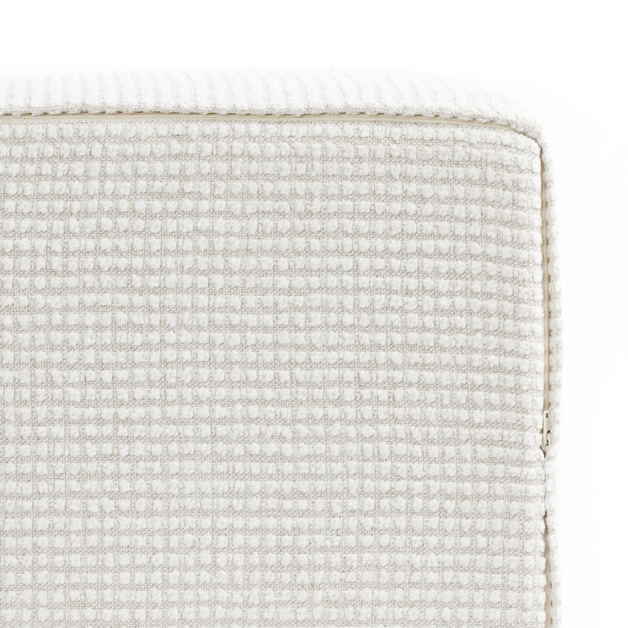 a cream textured grid patterned high performance fabric cube ottoman : bottom view