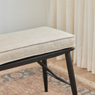 Chester Fabric, Flax by Tonic Living — high-performance upholstery fabric in soft neutral herringbone, shown on a bench seat cushion.