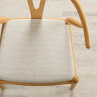 Dining chair upholstered in Chester Fabric, Flax — a durable, high-performance neutral home decor fabric by Tonic Living.