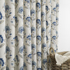Tonic Living Clara Denim curtain fabric shown as full drapery in blue and white floral print.