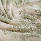 Tonic Living Colette Forest Green multi-use home decor fabric featuring scenic toile vignettes in green and beige.