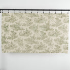 Full yard of Tonic Living Colette Forest Green fabric showing scenic pastoral toile design in green and natural tones.