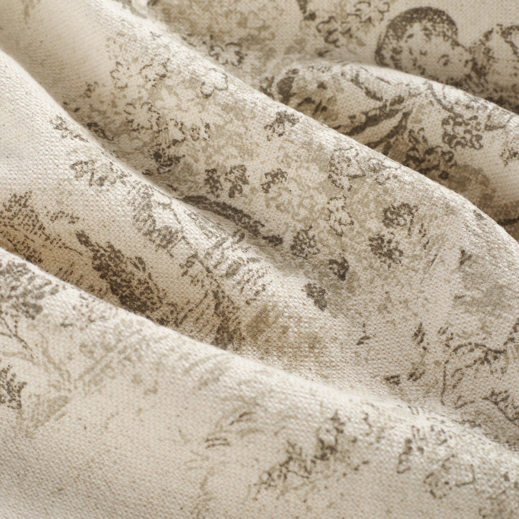 Close up of Tonic Living Colette Portobello fabric showing scenic toile detail in portobello brown and natural.