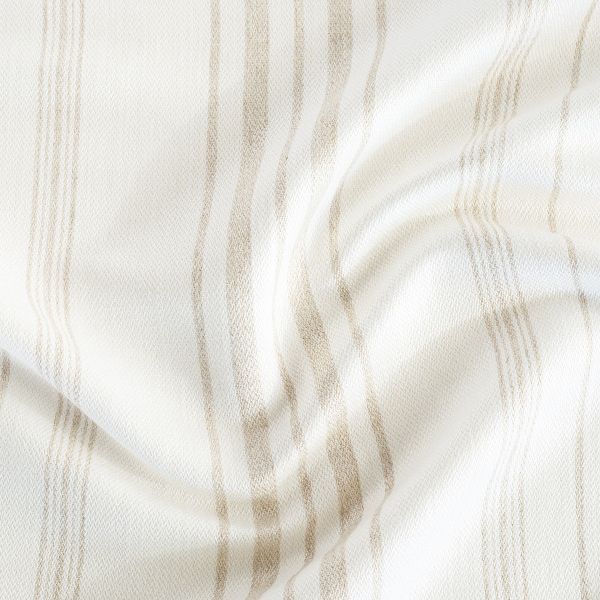 Collins Stripe Parchment, a white and beige vertical striped linen blend fabric from Tonic Living