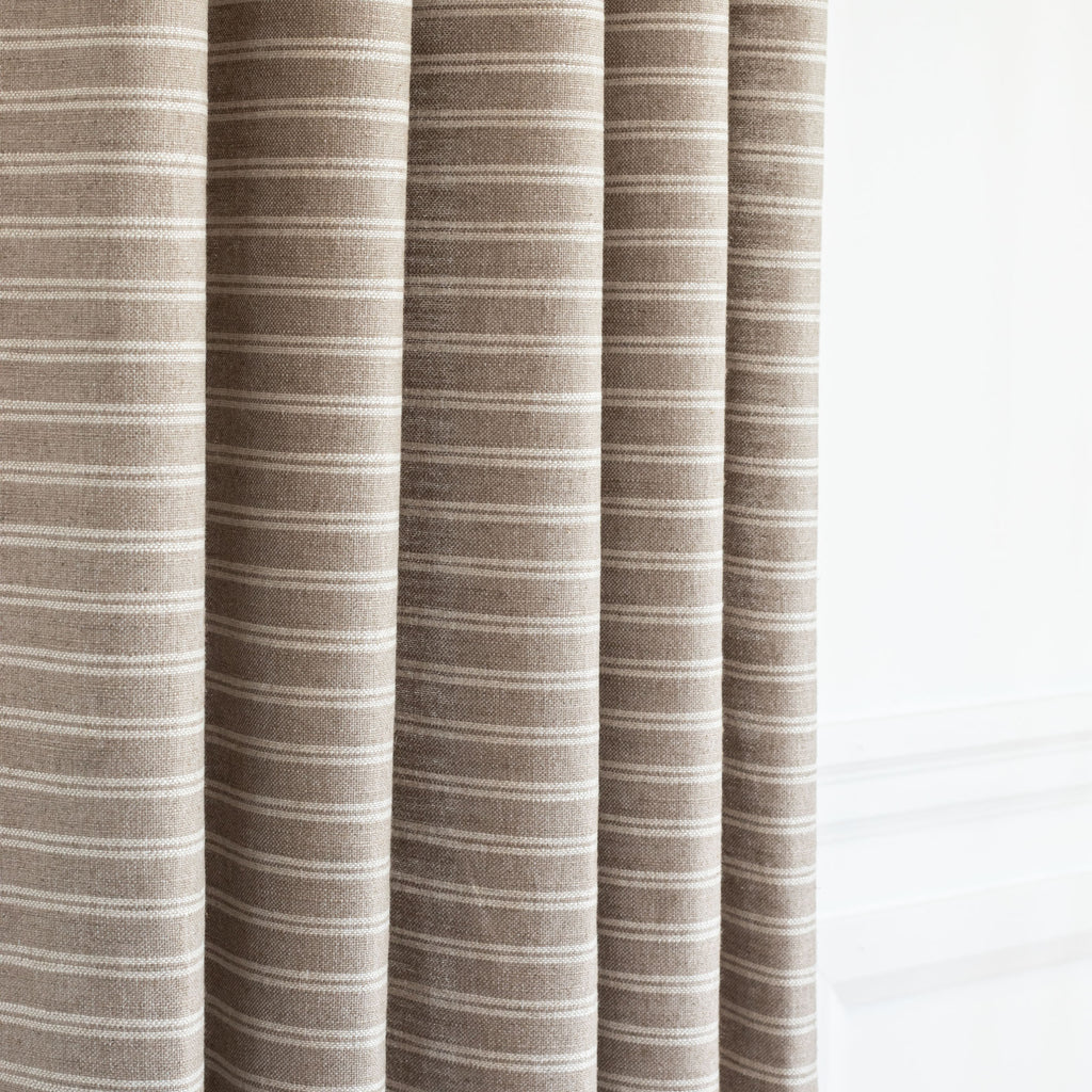 a soft brown and cream horizontal stripe drapery fabric