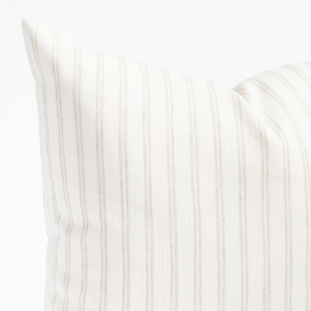 a soft white and beige vertical stripe style throw pillow : close up view