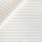 a white and greige stripe upholstery fabric