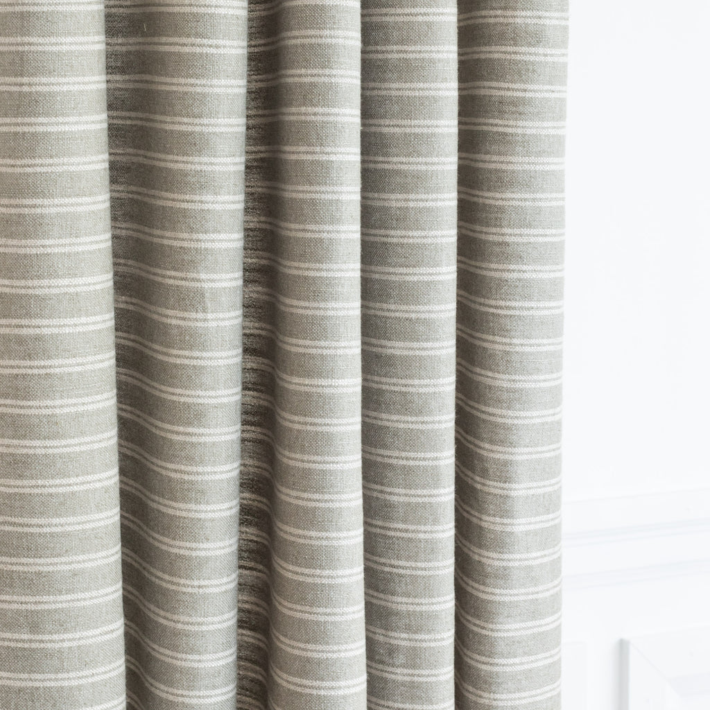 a sage green and cream horizontal stripe drapery fabric