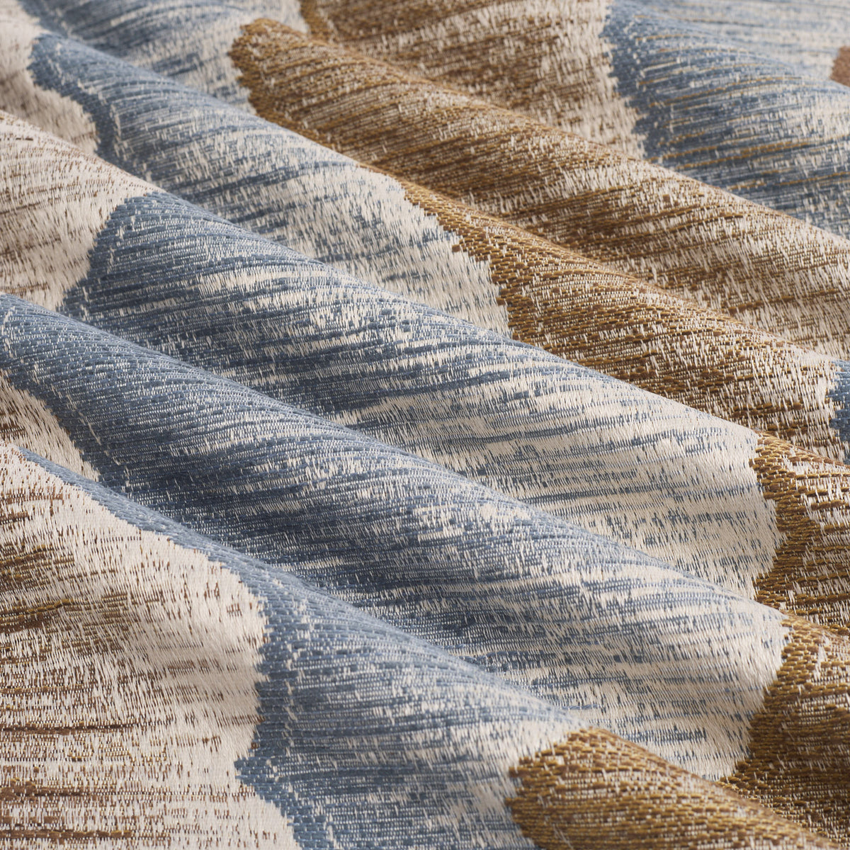Tonic Living Cortina Fabric in Storm, a contemporary blue and brown multi-use fabric with an organic abstract pattern.