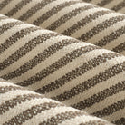 Close up of Tonic Living Crosby Stripe Truffle fabric showing its brown and beige stripes and woven texture.