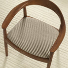 Tonic Living Crosby Stripe Truffle high-performance fabric shown upholstered on a dining chair seat with a neutral brown stripe.