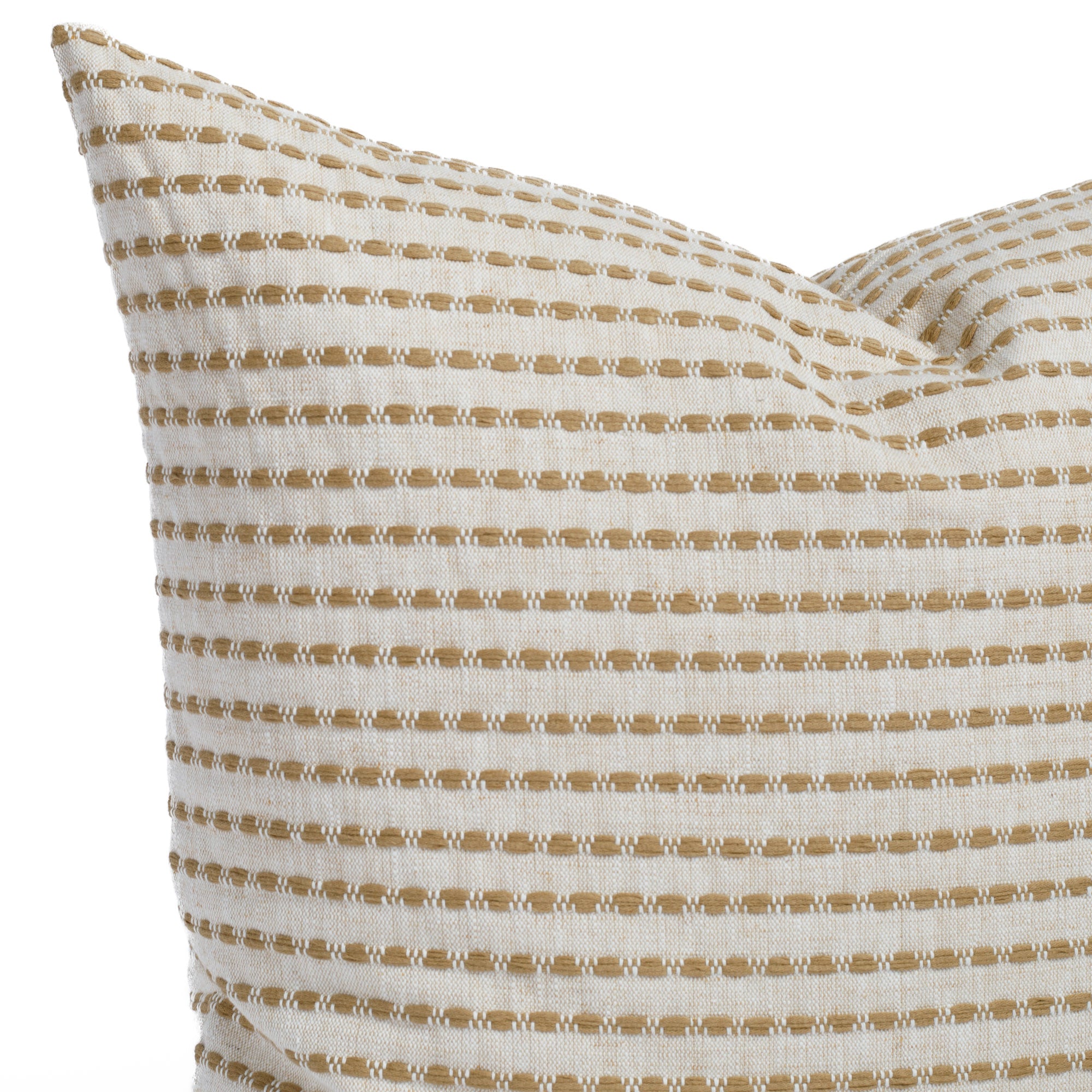 Close up of Dash toss pillow in ochre showing stitched stripe texture on beige and ivory woven fabric.