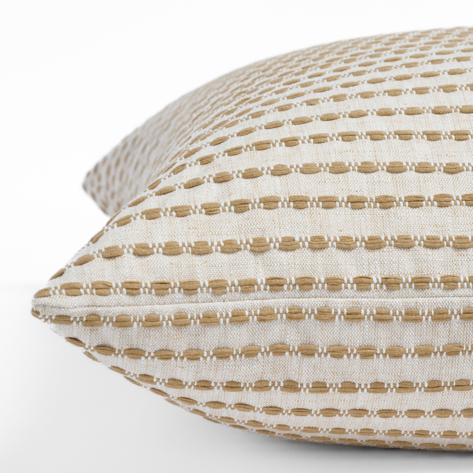 Side view of Dash 22x22 accent pillow in ochre with textured stripe fabric in beige and ivory neutrals.