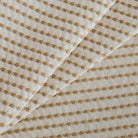 Tonic Living Dash Stripe Ochre neutral upholstery fabric with stitched stripe detail.