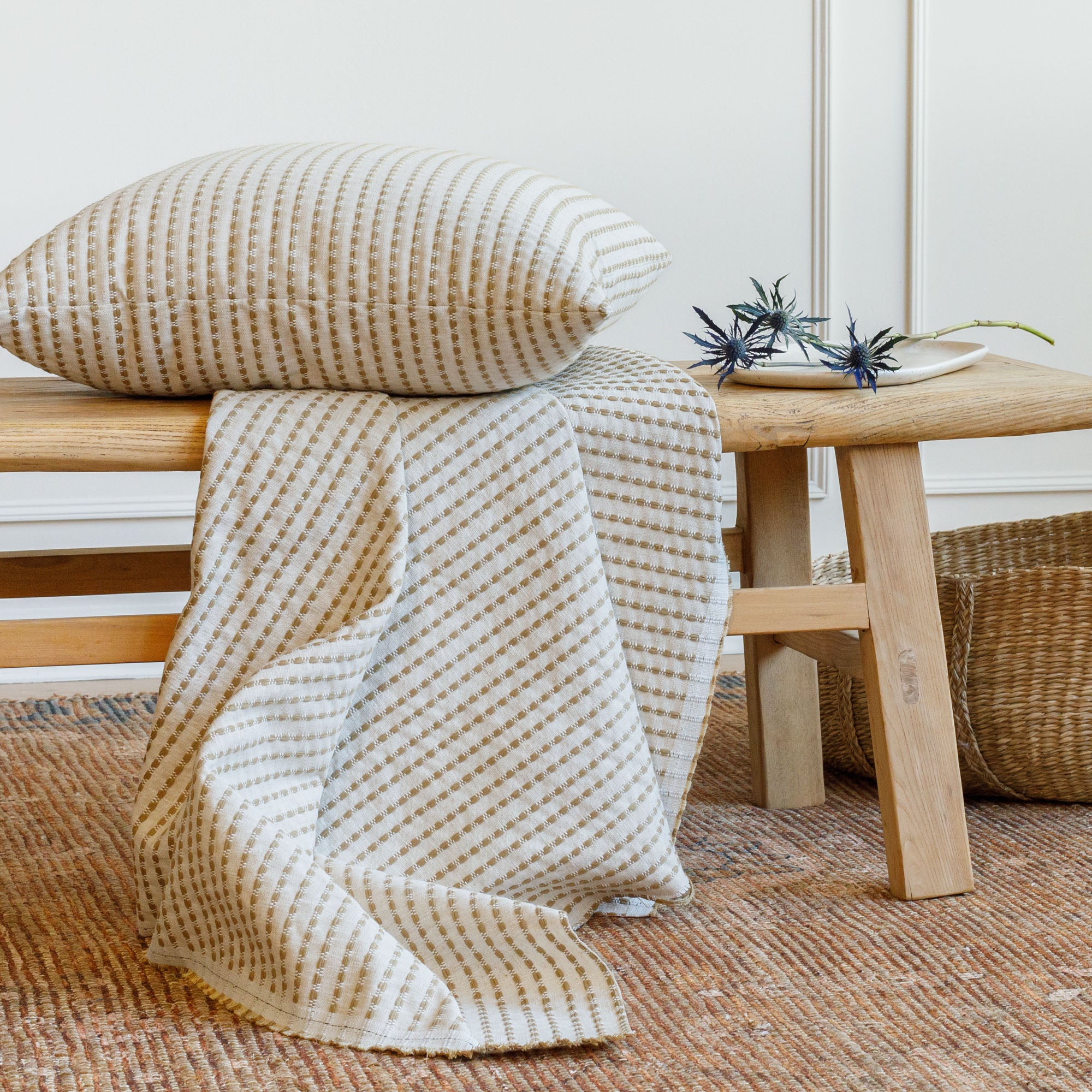 Tonic Living Dash Stripe Ochre neutral stripe upholstery fabric with matching pillow.