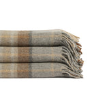 Stack of folded Tonic Living Duncan Plaid wool throw blankets in Tweed featuring brown, camel, and grey checks with fringed edges.