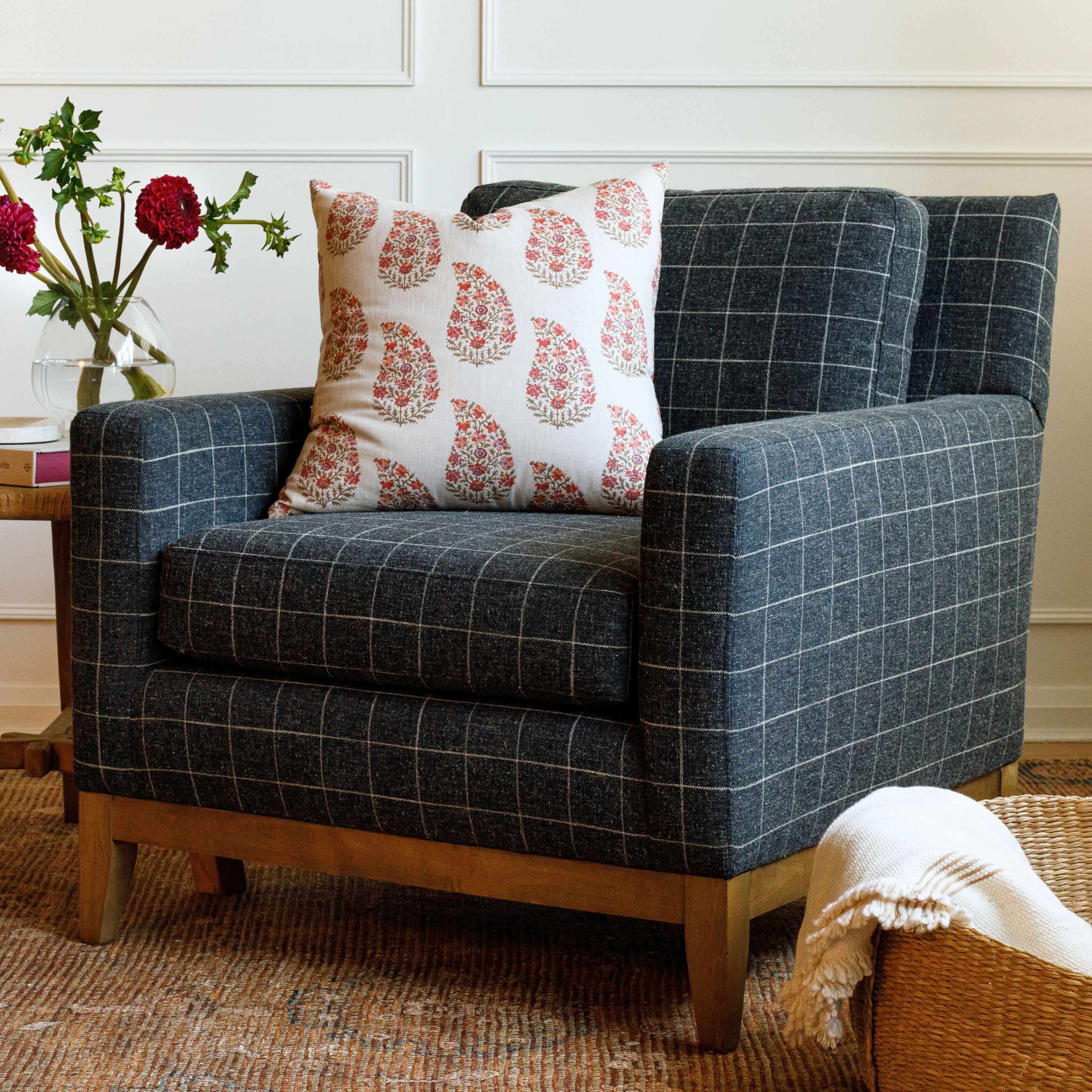 Dark brown-charcoal, plaid high performance upholstery fabric chair with a floral paisley pillow.