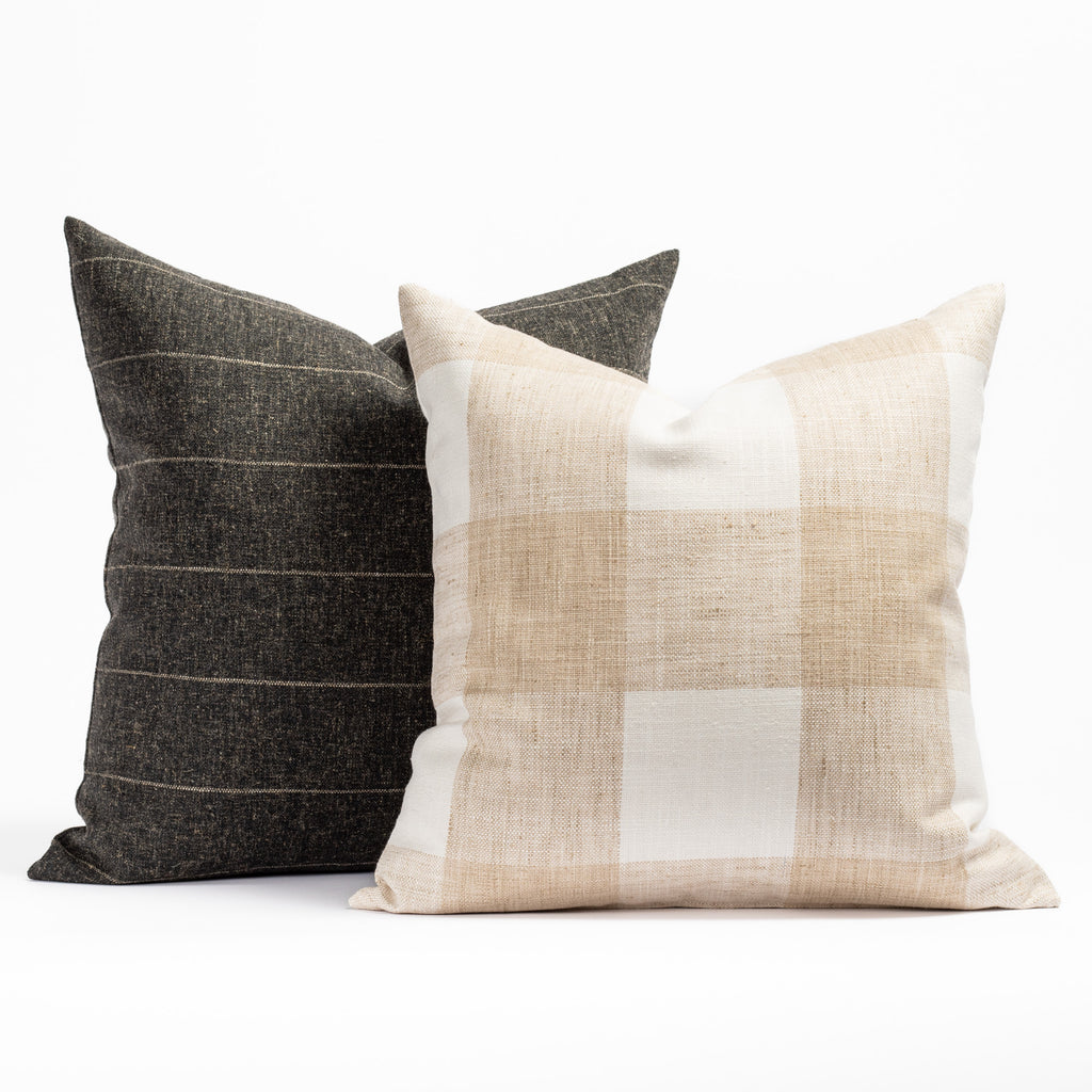Charcoal grey striped and a neutral cream and beige check patterned Tonic Living throw pillow pairing