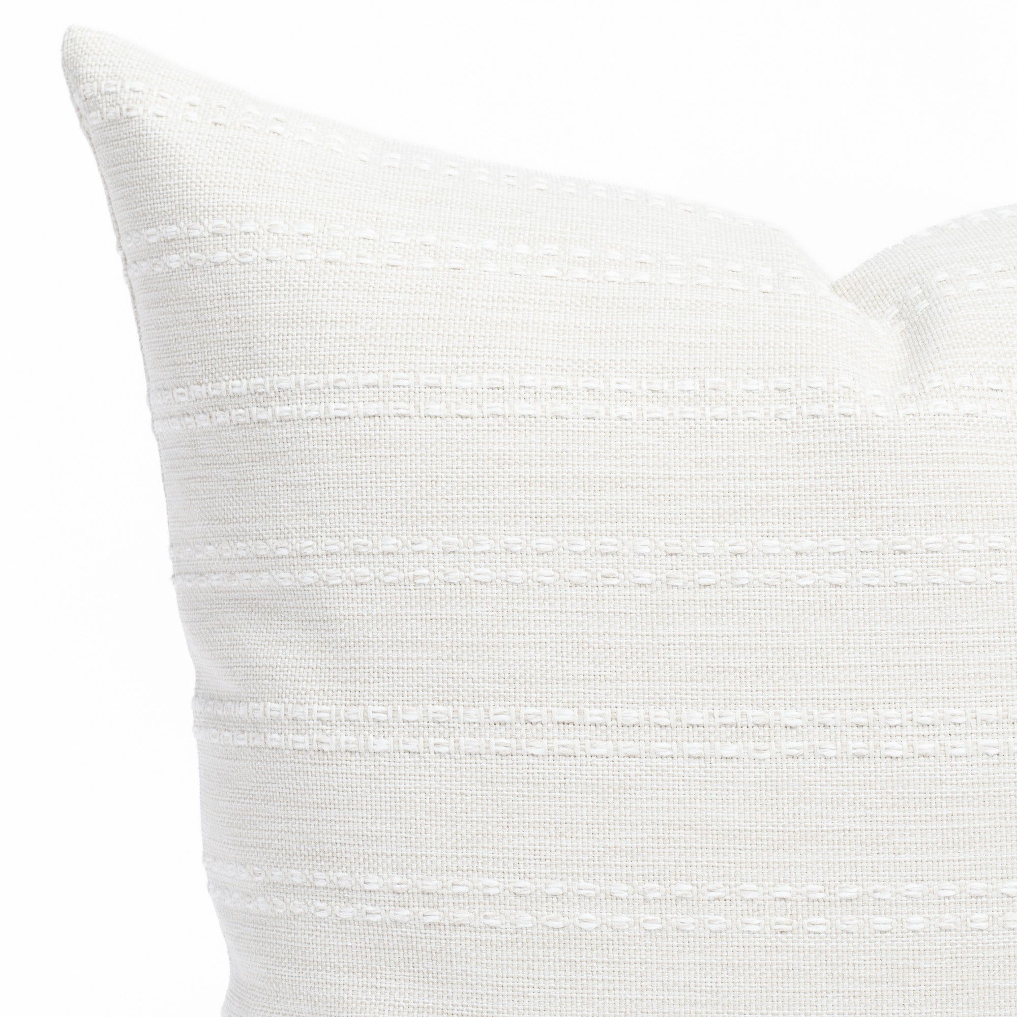 a soft white tonal stripe throw pillow : close up view