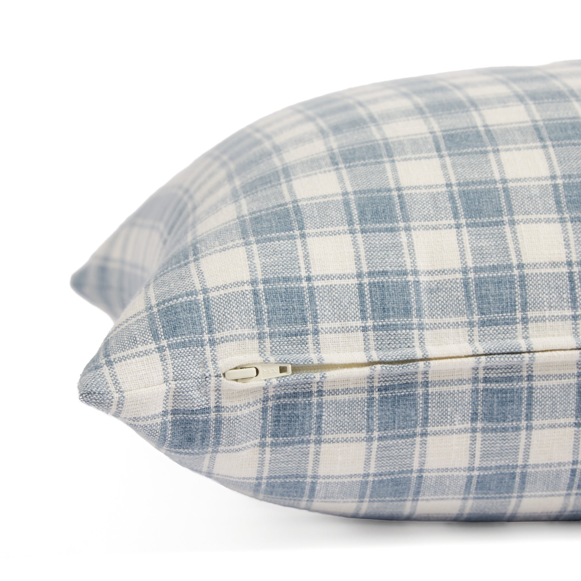Side zipper detail of Tonic Living Emmett Plaid 20x20 pillow in blue and white plaid.