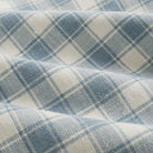 Close up of Tonic Living Emmett Plaid Denim Blue fabric featuring a refined small-scale plaid pattern.