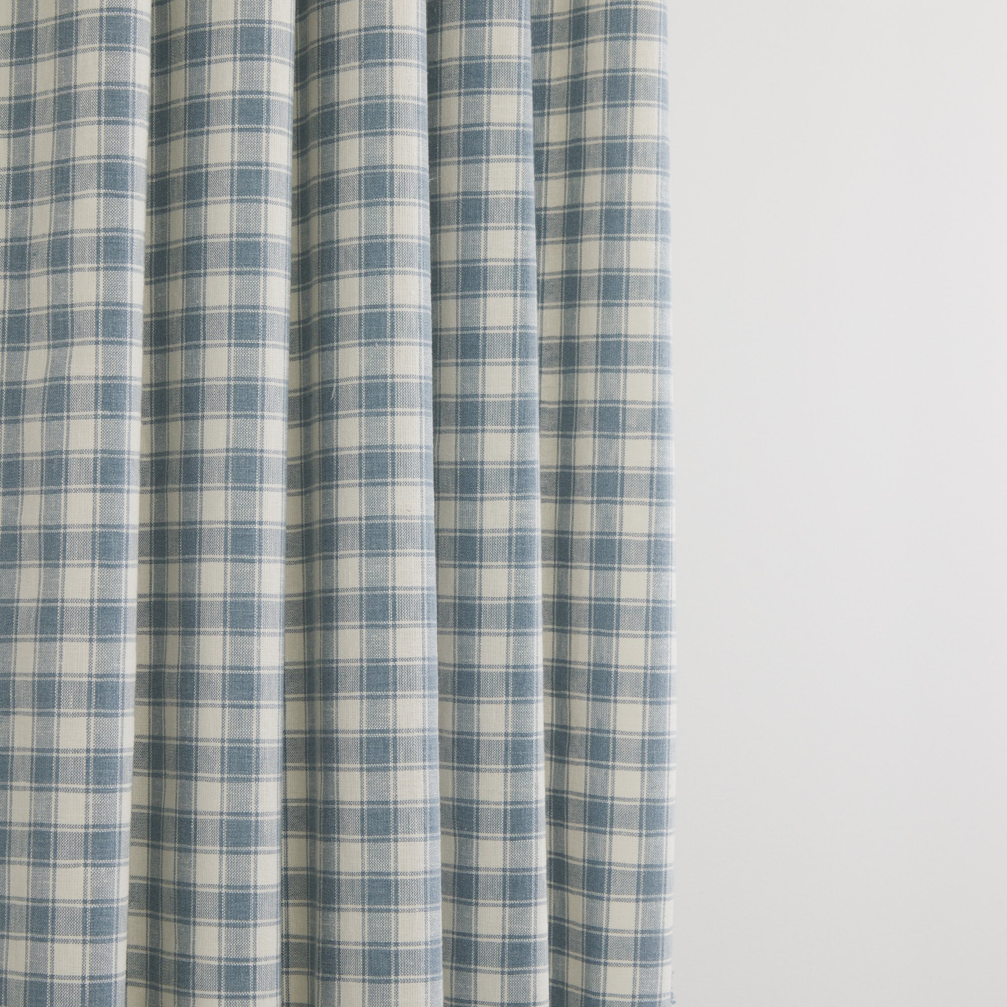 Tonic Living Emmett Plaid Denim Blue fabric suitable for curtains and window treatments in a classic check.