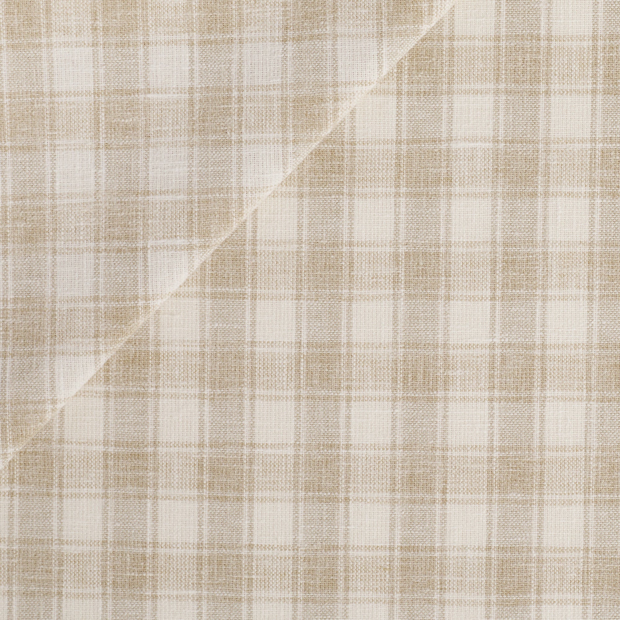 Tonic Living Emmett Plaid Fabric in Flax featuring a timeless beige and white check for upholstery and window treatments.