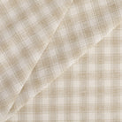 Tonic Living Emmett Plaid Fabric in Flax, a neutral upholstery fabric in soft white and flax beige small-scale check.