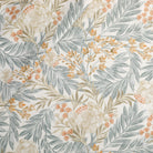 Tonic Living Fable Fabric in Meadow, a multicolour botanical drapery fabric with leafy blue, terracotta, and light brown motifs on soft white.